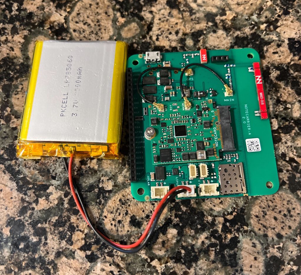 The asset tracker composed of a Blues Wireless Notecard, Notecarrier AL, and LiPo battery.