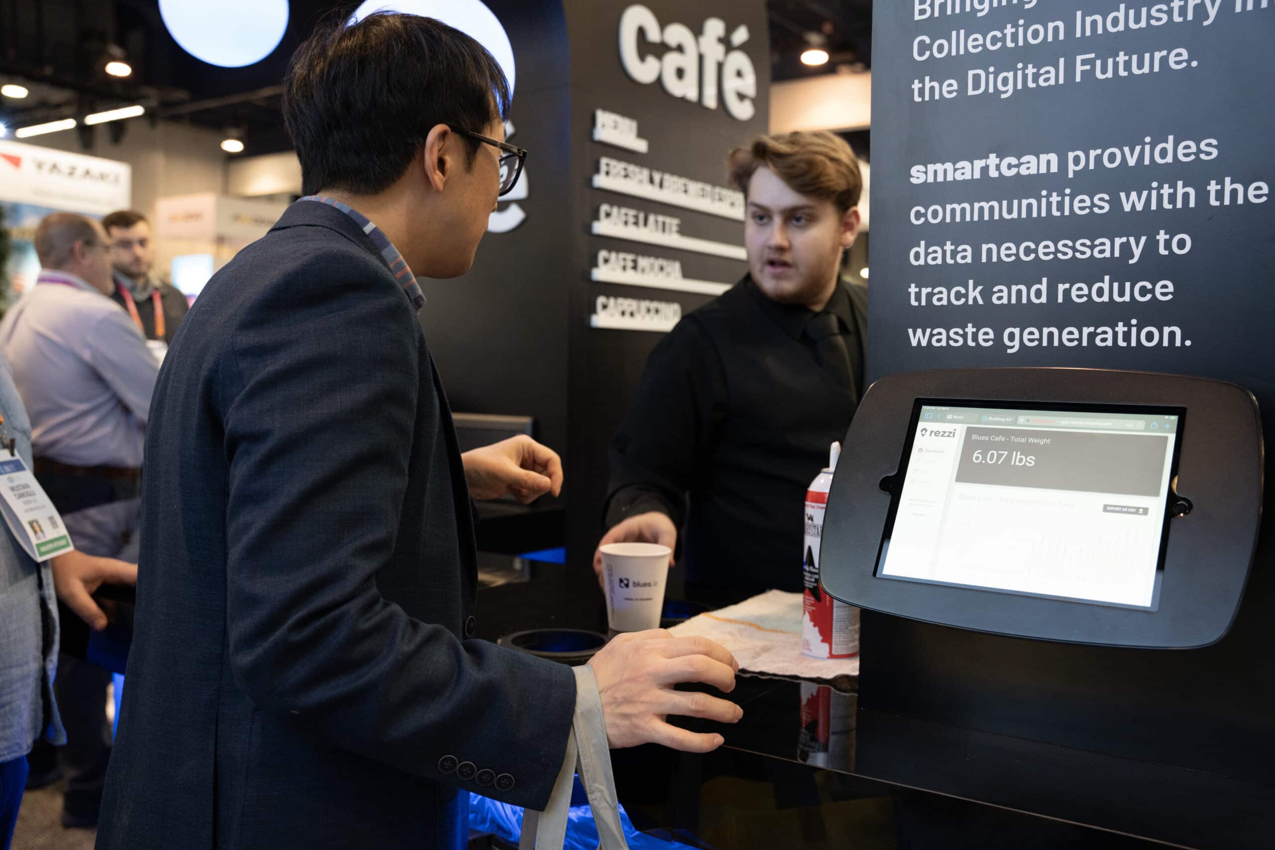 Barista serves coffee at Blues Café during CES 2023