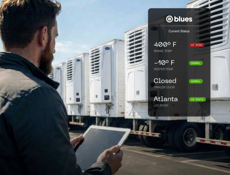 reefer truck fleet manager surveying trucks with tablet